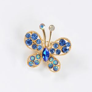 Brosa martisor fluture auriu cu pietre albastre