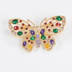 Brosa fluture auriu cu aripi colorate