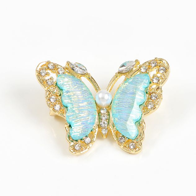 Brosa martisor fluture auriu cu aripi bleu